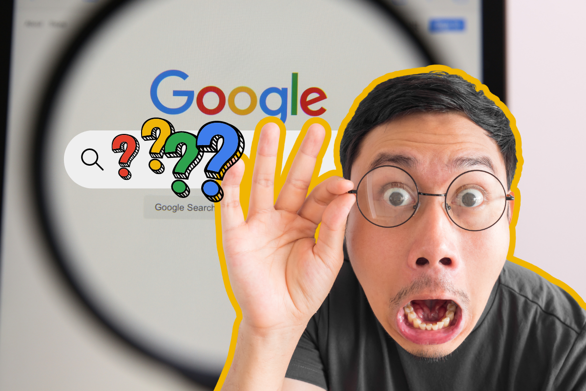 Man with surprised expression looking through a magnifying glass at the Google logo on a screen, with colorful question marks floating in a search bar.